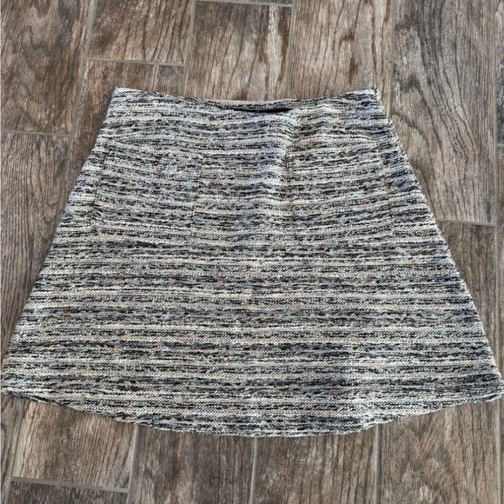 Loft tweed knit mini skirt in black and white with multicolored flecks.